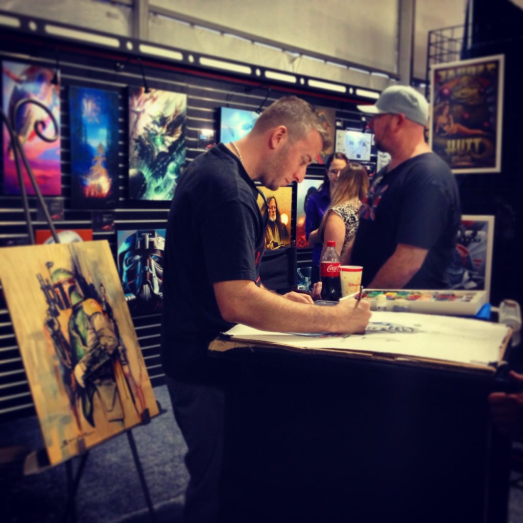 Lucasfilms' Star Wars illustrator Brian Rood  works on drawing Stars Wars art. 