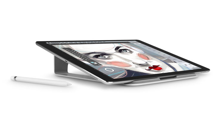 A tablet with a colorful design of a woman's face and an art pen. 