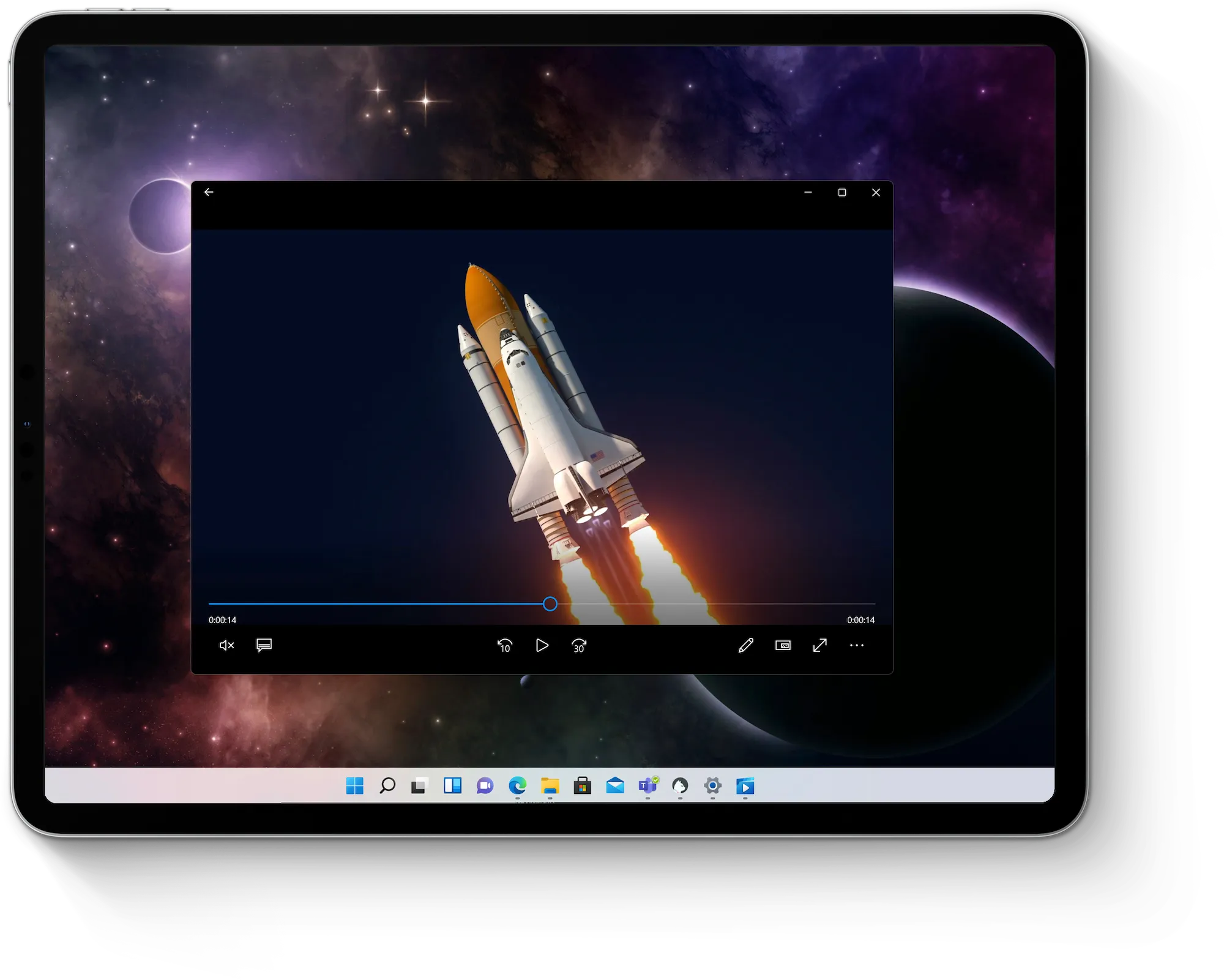 An iPad shows a video of a rocketship in space