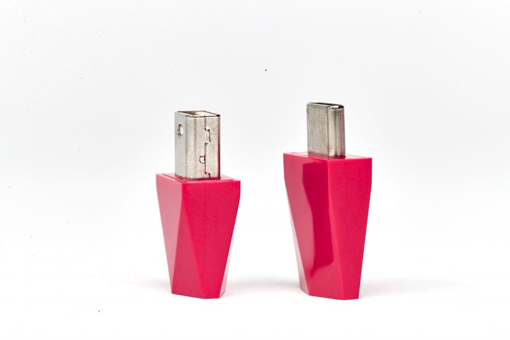 The bright pink Luna Display plugin for USB ports.