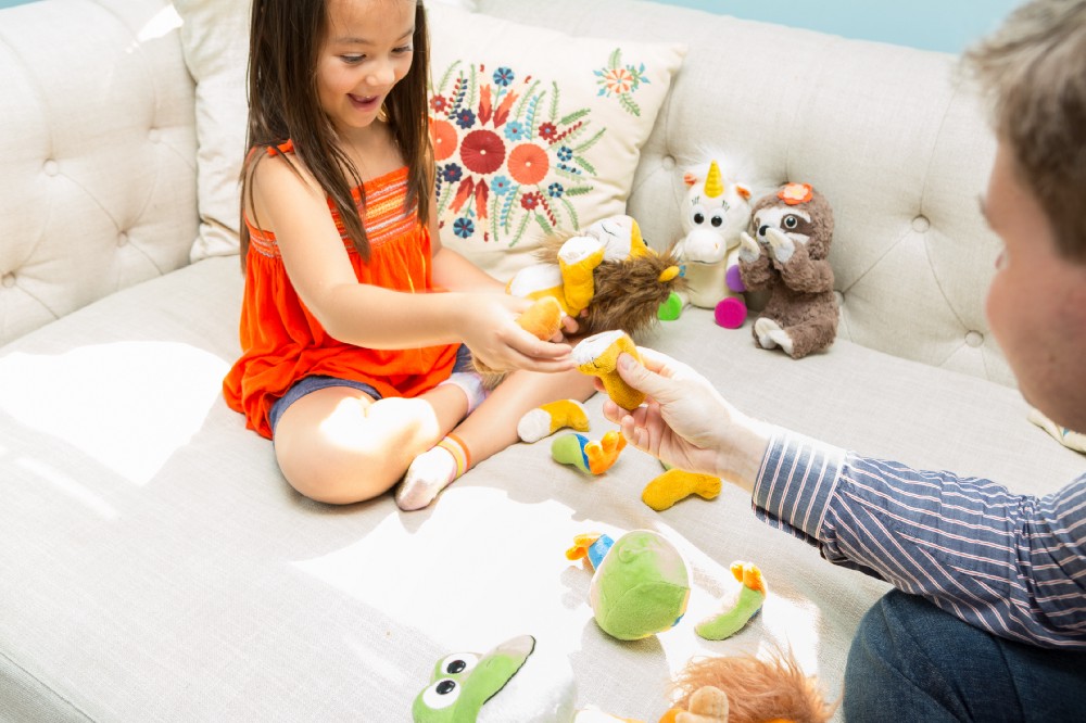A child plays with her Animoodles
