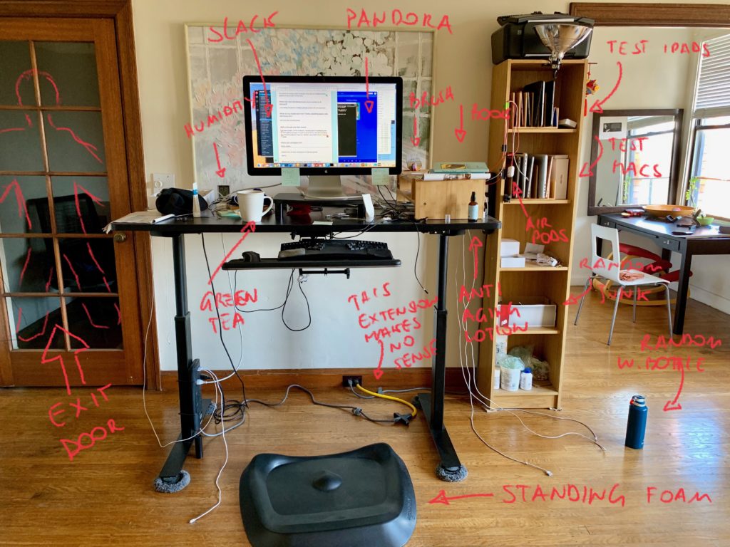 Giovanni's home office with a standing desk and computer. 