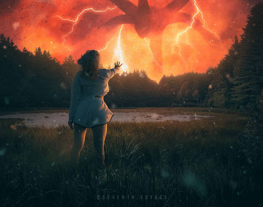 A girl with superpowers stands in a field holding back evil forces