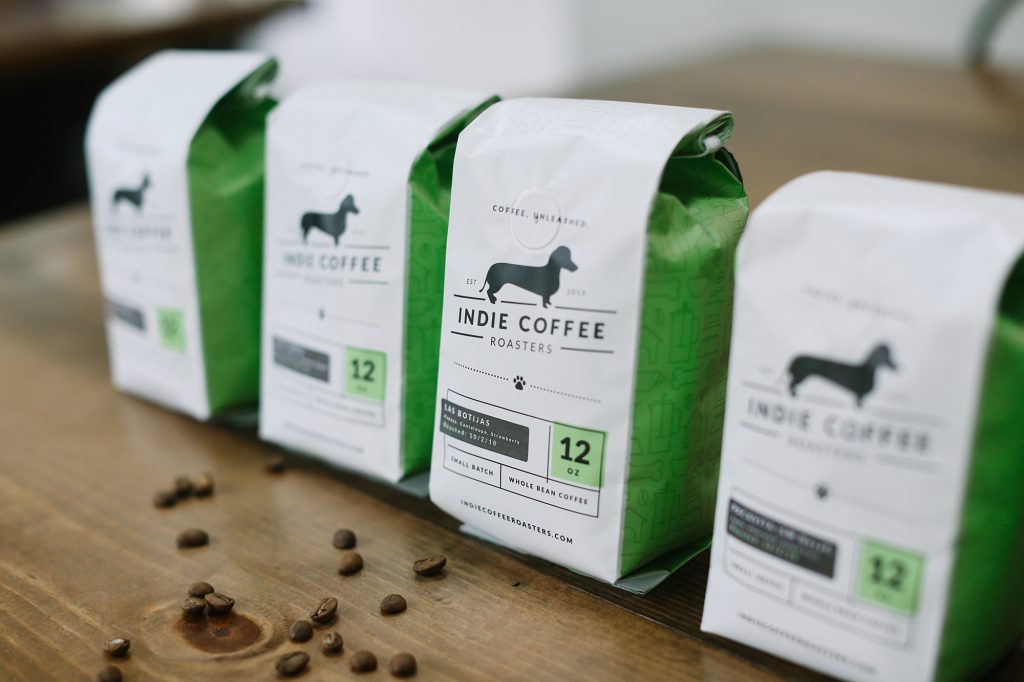 A few packs of Indie Coffee Roasters coffee beans 