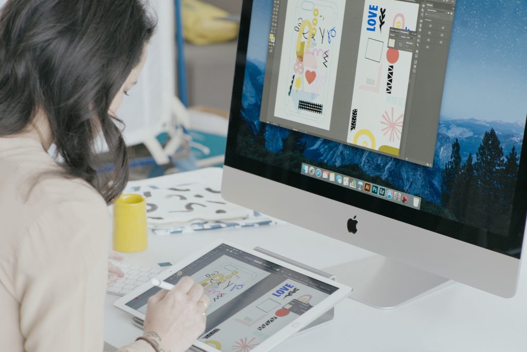 A woman working on a digital drawing tablet 