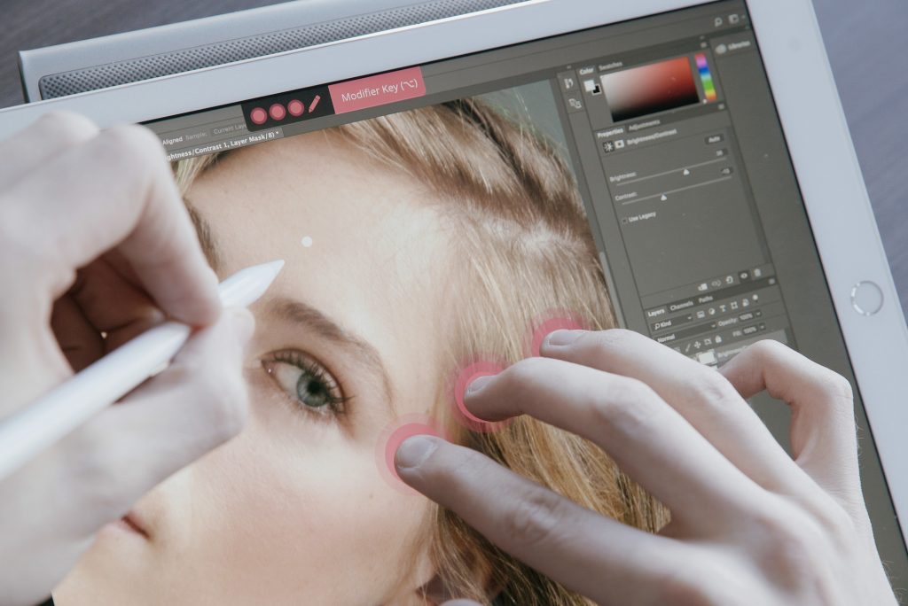 Retouching a photograph on a digital drawing tablet