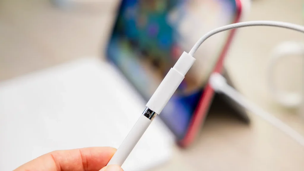 Apple Pencil Generation 1 plugged into a USB-C to Apple Pencil adapter. 
