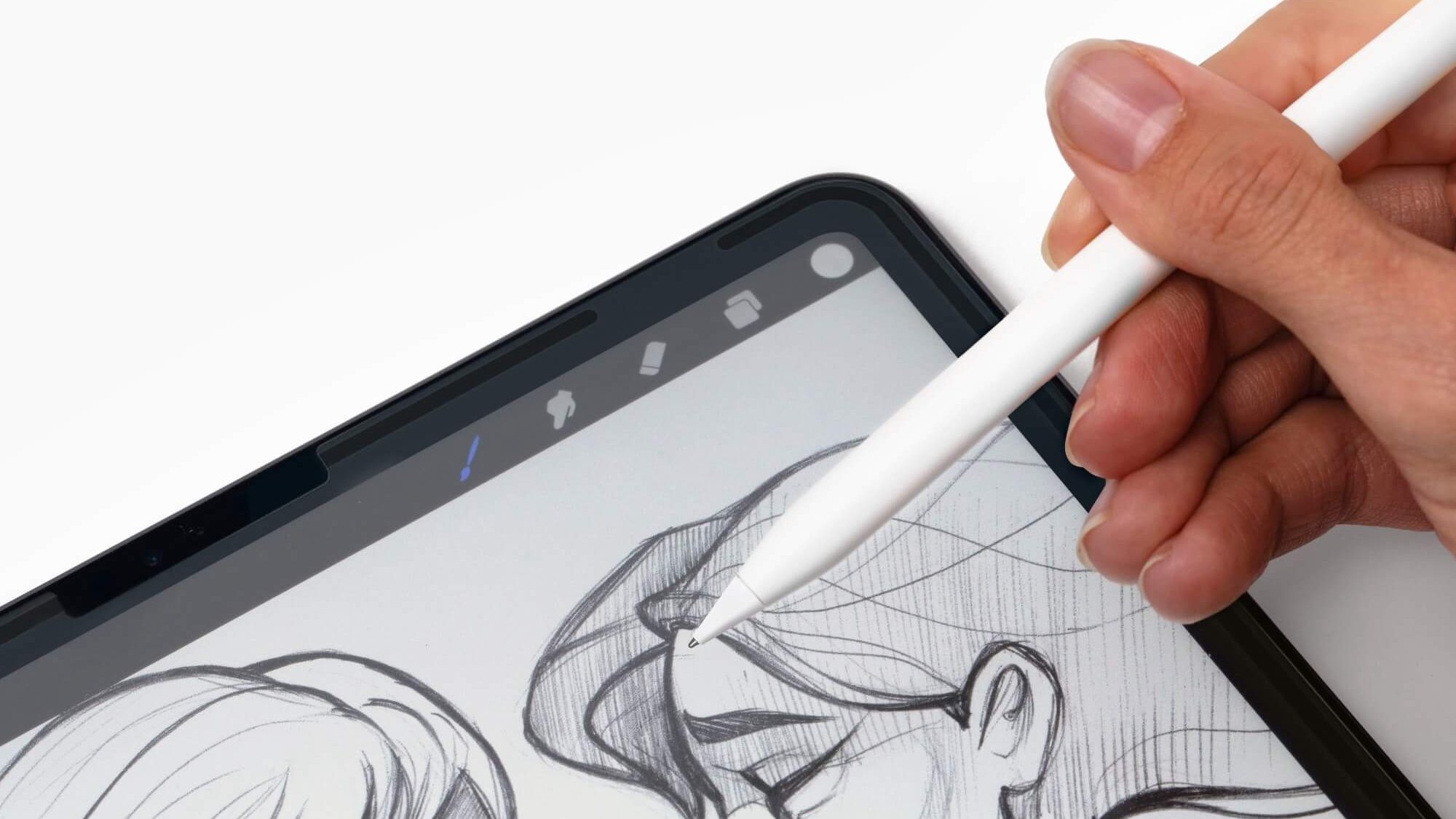 an iPad with a drawing of a woman and Apple pencil hovering over the screen 