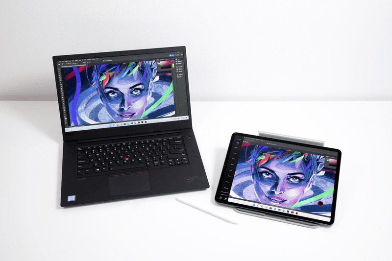 A Windows laptop and iPad on a white background running Photoshop through Astropad Studio