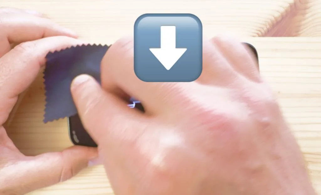 a closeup of hands showing how to remove air bubbles from a screen protector using pressure and pushing down on the screen of a phone.